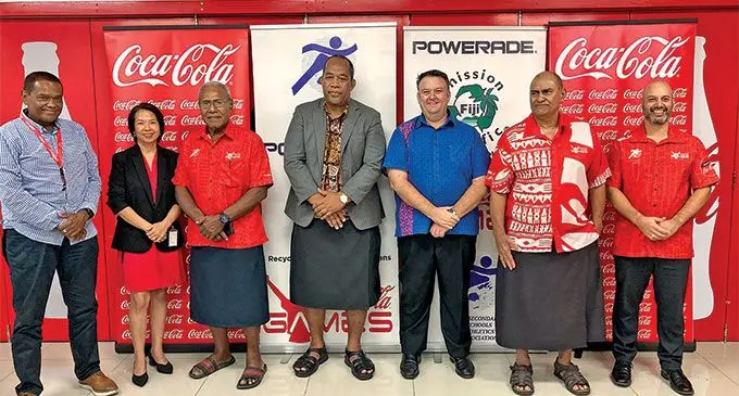 From left: Coca-Cola Europacific Partners marketing manager Lawrence Tikaram, Coca-Cola Europacific Partners human resources manager Emmy Elder, Coke Games coordinator Vuli Waqa, Ministry of Education deputy secretary Timoci Bure, Coca-Cola Europacific Partners general manager Roger Hare, Fiji Secondary Schools Athletics Association president Marika Uluinaceva, and Coca-Cola Europacific Partners chief financial officer Graham Rose in Suva on May 18, 2022. Photo: Coca-Cola Europacific Partners.