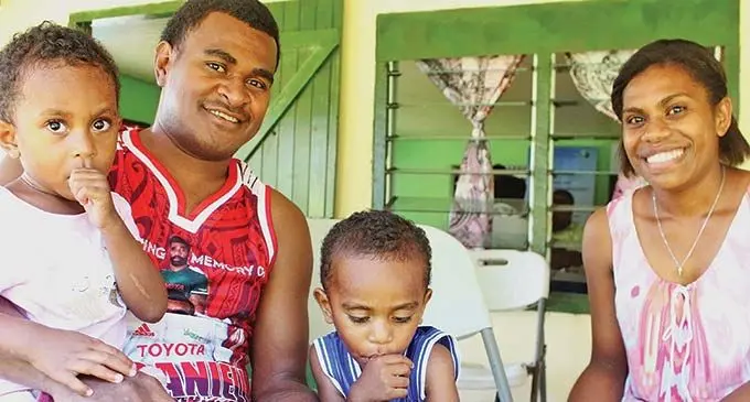 Kasanita Liku and Seru Rakuro with their children Ulamila and Tevita, taking advantage of the REACH programme in Batiri village. 