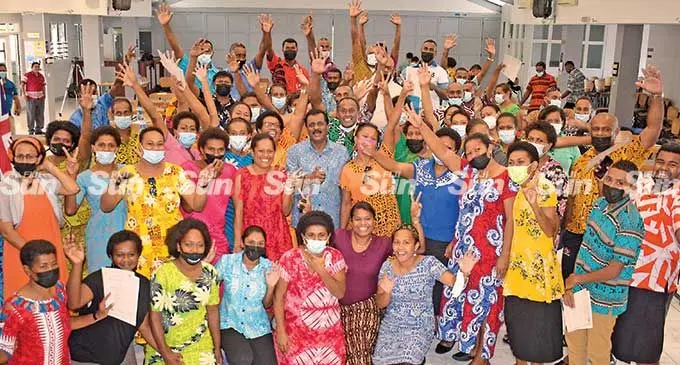 Seasonal workers with  Employment Minister Parveen Bala after receiving their Pacific Labour Scheme seasonal worker certificate on March 18, 2022.  Photo: Ronald Kumar
