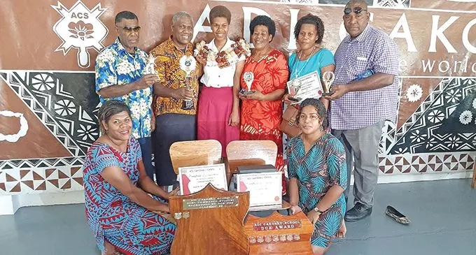 From left (standing): Silivinosi Tikoi (uncle), Etika Naulumatua (father), Dux Karalaini Naulumatua, Arieta Keteivalu (mother), Una Vunilaubu (cousin), Sesoni Bai (cousin)  Sereana Buirokomata (sister seated on left) and Akanisi Lewasei (sister) during the prizegiving ceremony at ACS on December 2, 2020.  Photo: Shreeya Verma