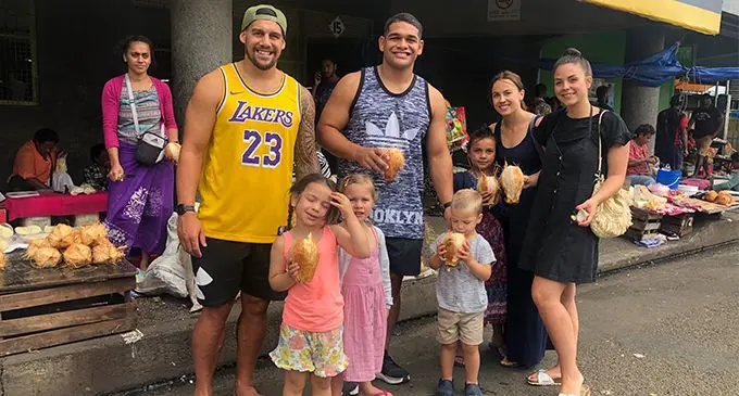 The Matavesi brothers, Joshua and Samuel with their families at the Suva market. Photo: Rosi Doviverata.