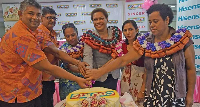Courts director of marketing Anil Senewiratne (left), Courts Director Retail Operations, Hamendra Prasad (second from left), and Minister for Women, Children and Poverty Alleviation Mereseini Vuniwaqa (fourth from left), with the women who were supported with equipment to help start their businesses by Courts. Photo: DEPTFO