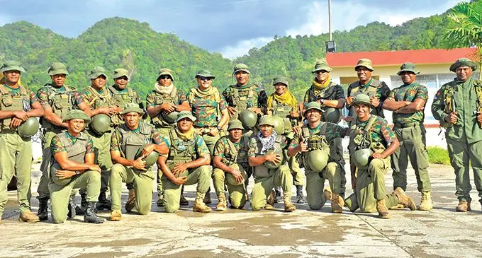 The Republic of Fiji Military Forces (RFMF) Shooting Team and their trainers with the only woman on the team, Sapper Seruwaia Loga (standing, eighth from left), at Nabukavesi, Namosi, after one of their training sessions. Photo: RFMF Media Cell