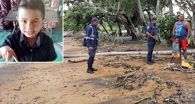 The Police search party at the Naqiroso Settlement in Velovelo, Lautoka, on January 31, 2021. Photo: Salote Qalubau INSET: Missing 3-year-old Karl Ratu.