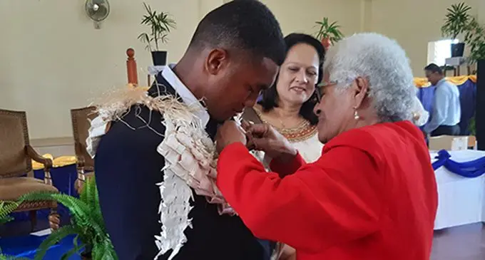 Proud grandmother Vani Seruvatu pins Head Boy’s badge on her grandson Mosese Qionimacawa at RKS on January 31, 2020.  Photo: Shalveen Chand