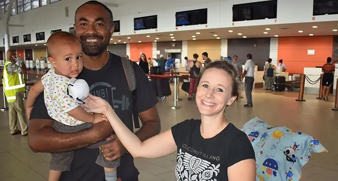 Paul Farrell Valemei holding 15-month-old Evan Inia Carter Valemei and Welsh-born Victoria Alice Carter at the Nadi International Airport on April 29, 2020.   Photo: Waisea Nasokia 
