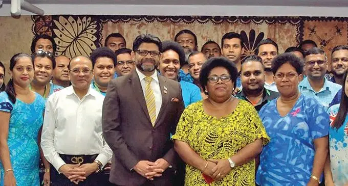 From left: Attorney-General and Minister for Economy Aiyaz Sayed-Khaiyum (centre) and  Energy Fiji Limited (EFL) chief executive officer Hasmukh Patel with staff during the dividend payout by EFL in Suva on October 9, 2019. Photo: Laiseana Nasiga.