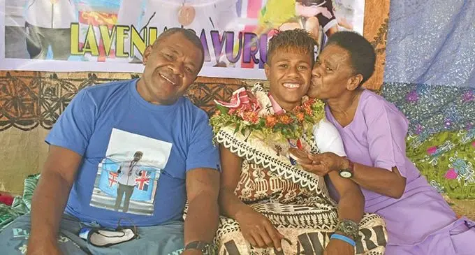 Fijiana Olympian and bronze medallist Lavena Cavuru with proud parents Alisi Lewavulawai (right) and Iliesa Navunidaliga during the celebration on August 25, 2021.  Photo: Waisea Nasokia