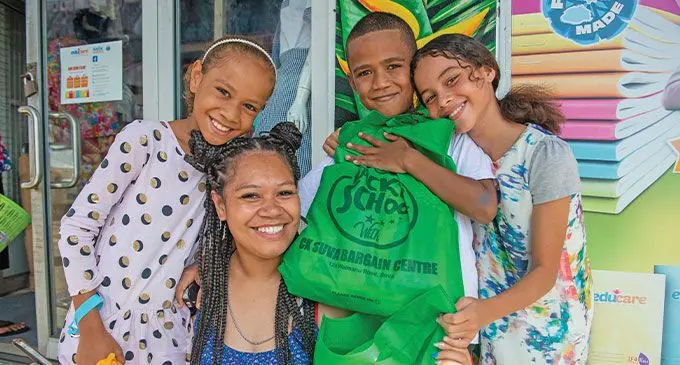 Single mother Talei Sokoiwasa (middle) is flanked by her children, Virisila Naikelekelevuki 9, (left) Paula Naikelekelevuki, 8 and Mary Qali, 10, after their back-to-school shopping in Suva on January 28, 2024. Photo: Leon Lord