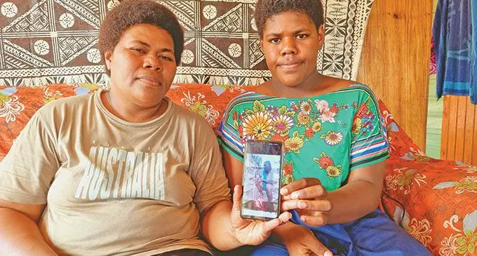 Makelesi Dikuvasere (left) and daughter Kelera Nava, with a photo of the late Mr Wiliame  Tavanavua Nava on June 5, 2022, at Vatudova Village in Tabia, Labasa.  LEFT INSET: The late Wiliame Tavanavanua Nava.  Photo: Sampras Anand
