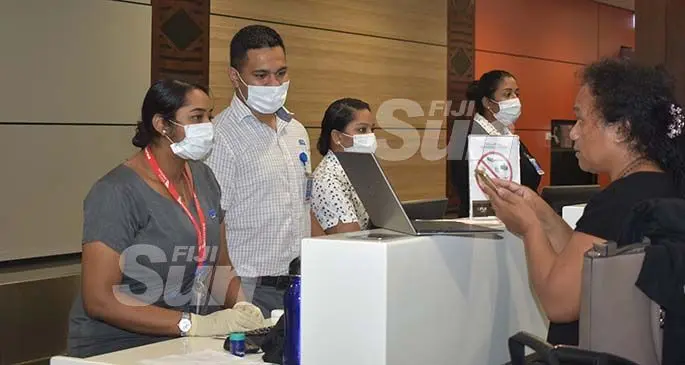 Air Terminal Services staff, wearing masks, serve travellers at the Nadi International Airport on January 27, 2020. Photo: Mereleki Nai.