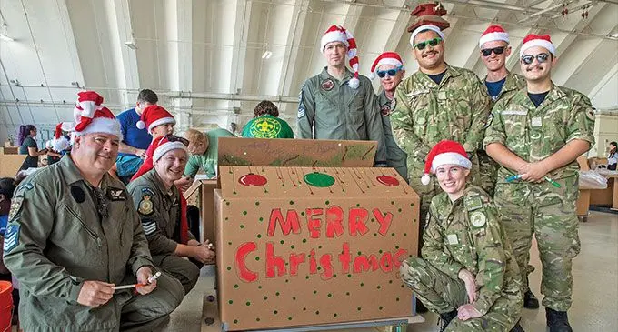 RNZAF No. 40 Squadron crew packing aid bundles as part of Operation Christmas Drop at Andersen Air Base, Guam. Photo: Royal New Zealand Defence Force