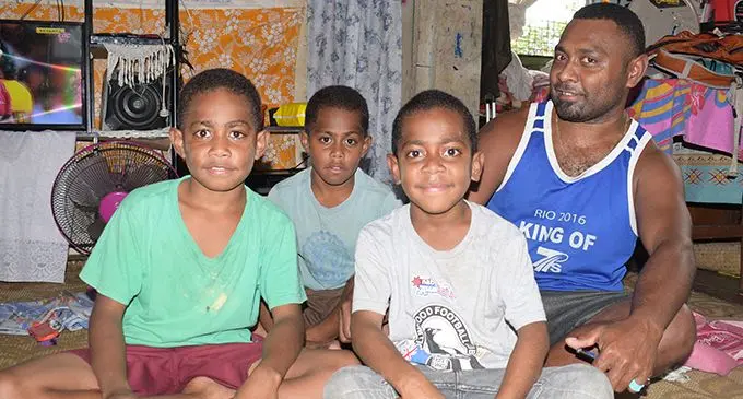 From left: Kaveni Seru, Manasa Railati, Senivalati Vunibola with their father Navitalai Moceica, inside their family home at Jittu Estate, Suva, on June 6, 2019.  Photo: Simione Haravanua