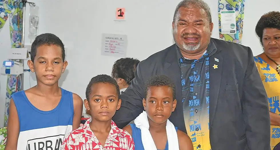 Minister of Youth and Sports, Jese Saukuru, with children at the Children’s Ward in Lautoka Hospital during a trip in December 2023
