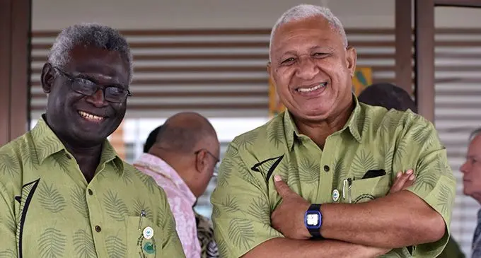 Solomon Islands Prime Minister Manasseh Sogavare (left), and our Prime Minister Voreqe Bainimarama after the opening of the Climate Change ‘Sautalaga’ (talanoa) yesterday at the Right Honourable Sir Tomasi Puapua Convention Centre in Tuvalu.  Photo: Ilaitia Ravuwai