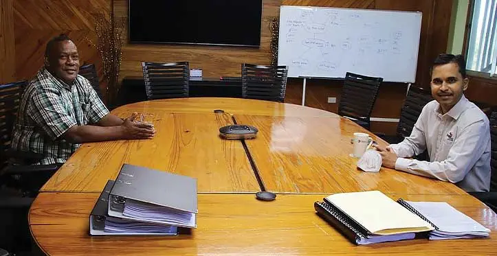 Fiji Pine board member Mataiasi Nabau Saukuru (left) with outgoing Fiji Pine chief executive officer Vimlesh Kumar.