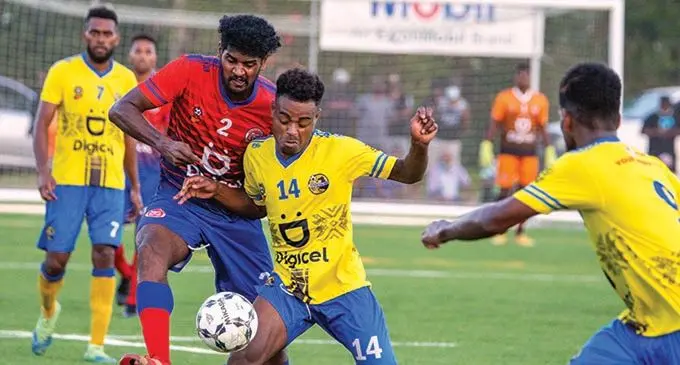 Nadroga captain, Tomasi Tuicakau (14), defends the ball against Navua’s Zainal Ali during their match at Uprising Sports Complex, Pacific Harbour on October 24, 2021. Photo: Leon Lord