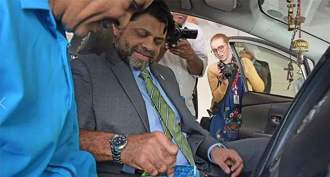 Attorney-General and Minister for Economy Aiyaz Sayed-Khaiyum launches the ANZ POS with Ever Ready Taxis with company owner Ramzan Ali.