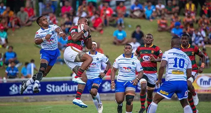 Terio Tamani (left) of TotalEnergies Police goes aerial against Epi Loganimoce of the Subrails Furniture RFMF during their FMF Ratu Sukuna Bowl clash at the HFC Bank Stadium in Suva on November 25, 2022. Police won 19-11.