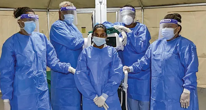 Leba Baleikanacea (back right) with colleagues from Labasa who were called to work at the FEMAT Field Hospital in Lautoka.