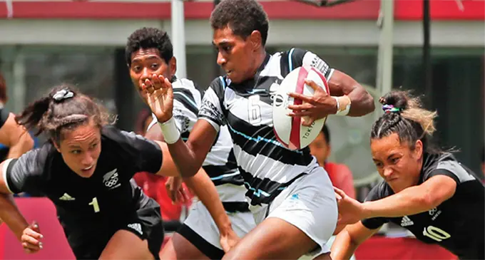 Team Fiji women’s rugby sevens halfback Reapi Uluinasau runs past New Zealand’s Ruby Tui during the main semifinal at the Tokyo 2020 Olympic Games in Japan on July 31, 2021. Uluinasau scored seven tries during the Olympic Games competition as they settled for the bronze medal while New Zealand took out the gold with France claiming the silver medal. Photo: Tokyo 2020 Olympic Games.