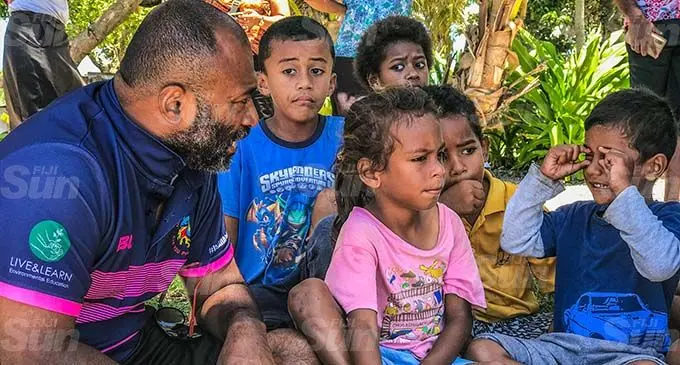 Minister for Health and Medical Services, Dr Ifereimi Waqainabete talking on the beach with children of Nukuni village in Ono-i-lau island. Photo: Kelera Sovasiga
