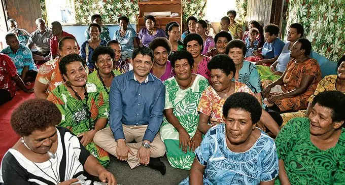 Attorney General Aiyaz Sayed-Khaiyum with women from Korobebe Village.  Photo: DEPTFO News