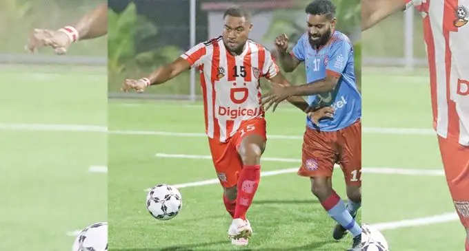 Labasa midfielder IlisoniTuinawaivuvu goes for the ball as Nasinu’s Jonetani Buksh closes in during their Digicel Premier League clash atUprising Sports Centre in Pacific Harbour, Deuba, on June 25, 2022. Photo: Fiji FA Media.