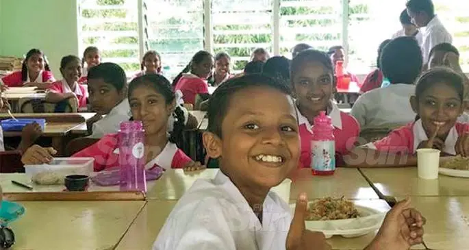 Students of Mulomulo Primary School tuck into their food provided by the friends of Inner wheel Club Steigerwald together with former scholars. Photo: Waisea Nasokia