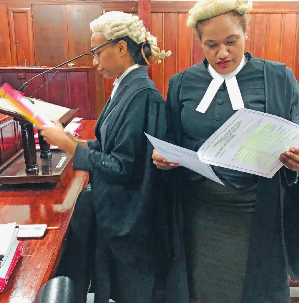 Susan Serukai (right) at work.