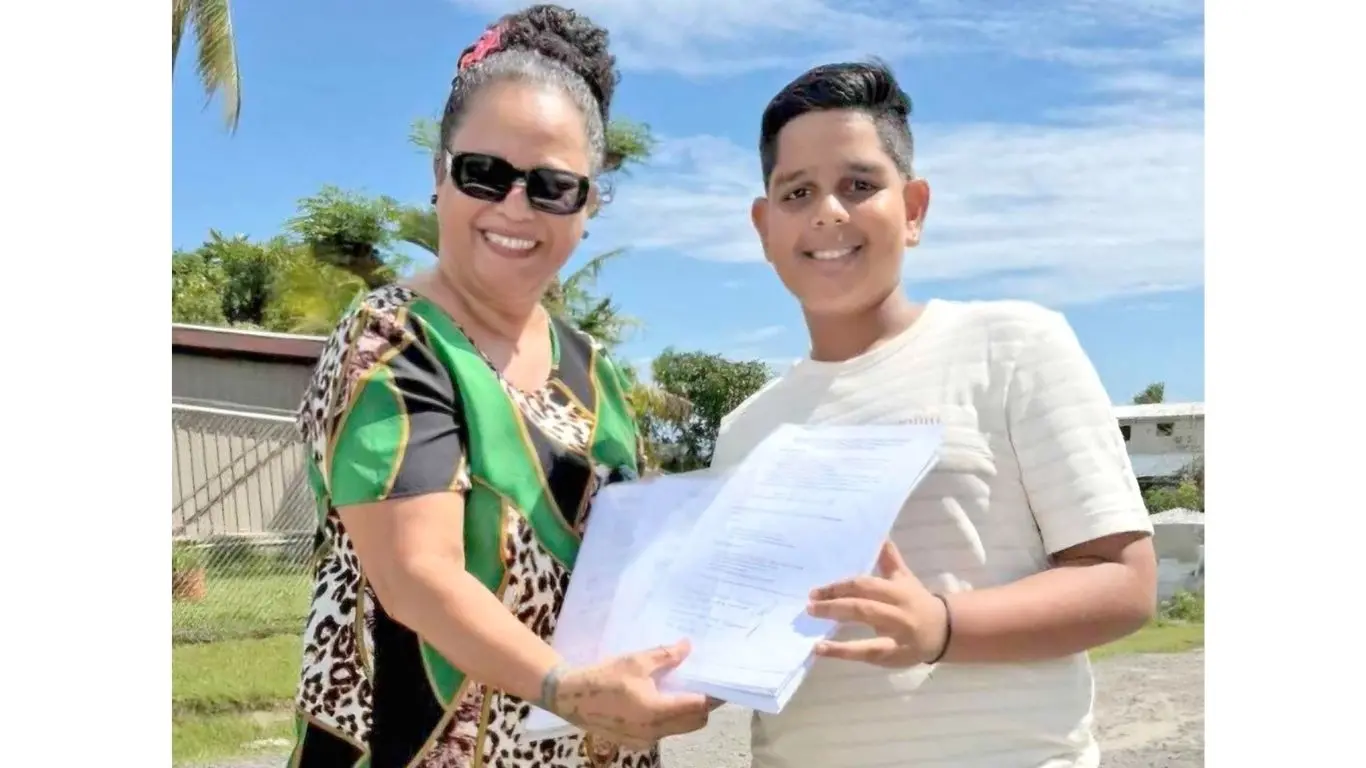 Vuda-Saweni TNG Project Objection Taskforce member Eunice Molia (left) with Yaeesh Reddy, holding the petition with 204 signatures against the proposed Vuda waste-to-energy project.
