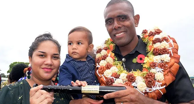 Police passing out parade baton of honor recipient, Sakiusa Tagicakibau (third from left) with wife Ruth and son, Mosese Tagicakibau at Nasova Police Academy on October 18, 2019. Photo: Ronald Kumar