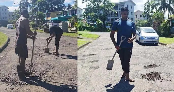 Aben Dean (right), with his employee patching the road at Kapadia Place in Raiwai on April 13, 2021.
