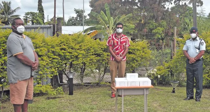 Mataiasi Nabau and Ashfaaq Khan with boxes of facemasks. Photo: Mereleki Nai