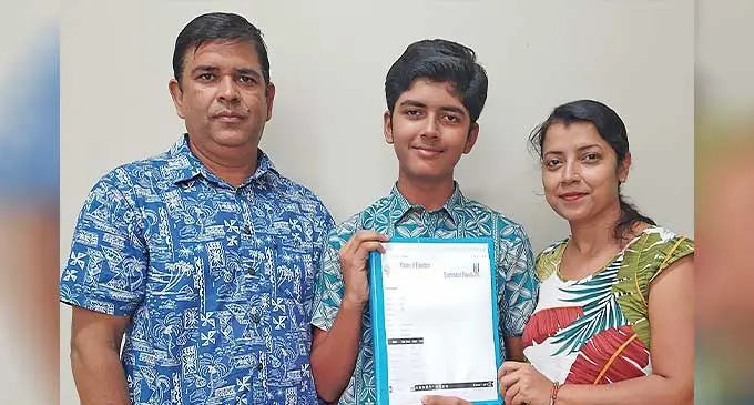 Ayush Shukla with proud parents Udya, left, and Mamta Shukla at their home.