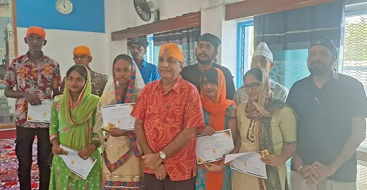 Minister for Multi-Ethnic Affairs and Sugar Charan Jeath Singh, third from left, front row, with receipients of the $500 help, including Gurdeep Singh (standing back, from left) at the Lautoka Sikh Temple on February 5, 2023. Photo: Waisea Nasokia