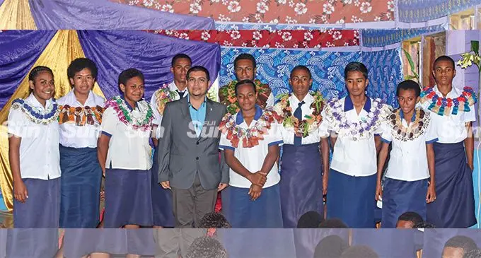 Promex Consulting PTE Limited general manager Lawrence Kumar (middle)with senior prefects. Photo: Waisea Nasokia