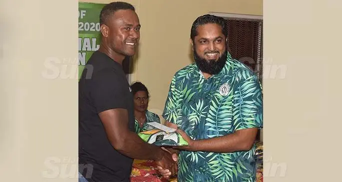 Nadi defender Ame Votoniu receives his jersey from former NFA presidet Javed Ahmed during the presentation night at Korovuto College on August 5, 2020. Photo: Waisea Nasokia