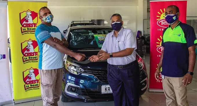 Sada Nand (left) receives the key to his new car from MH and MaxVal-U supermarket head of operations Neil Gurusamy and Goodman Fielder area sales representative in Suva Muneshwar Raju at the Carpenters showroom in Walu Bay on August 3, 2021. Photo: Leon Lord