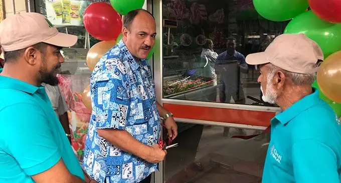 Nadi Town Council chief executive officer Craig Powell (middle), cuts the ribbon during the official opening of the M Gul Halal Meats butcher shop in Nadi Town on July 3, 2020.  Photo: Waisea Nasokia