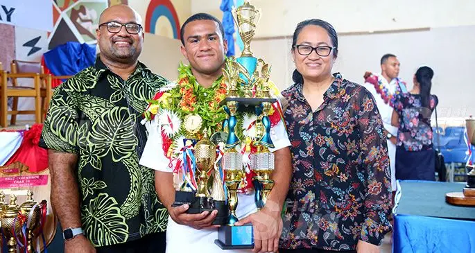 Dux Award recipient Temafa Yalimaiwai with parents Banuve and Emily Yalimaiwai with his trophies after the prize giving ceremony on October 11, 2019. Photo: Kelera Sovasiga