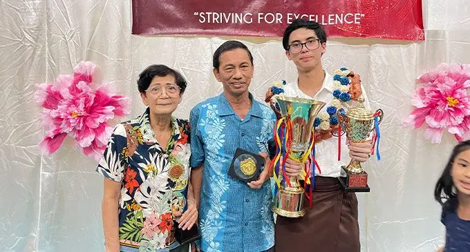 Virgilio de Asa III with his proud grandparents Dr Virgilio de Asa Snr and wife during the Annual Awards Ceremony at Yat Sen Secondary School.