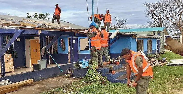 Members of the Republic of Fiji Military Forces and the Fiji Emergency Medical Assistance Team assisting in the cyclone recovery in Vanuatu. Photos: NDMO