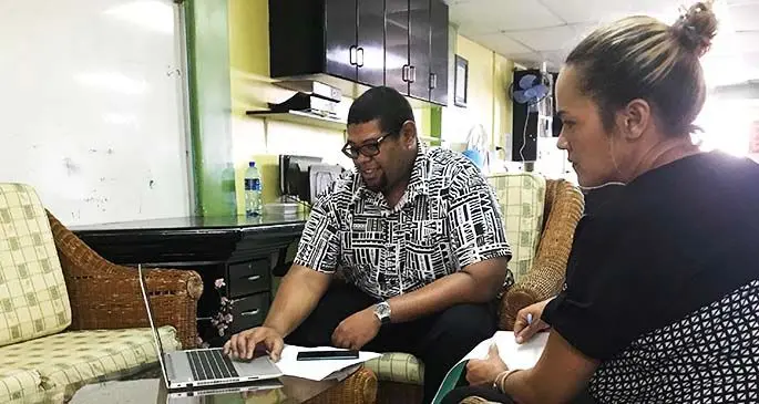 Webmedia South Pacific business development manager Nathan Powell, left, explains the features of the Pacific Actions COVID-19 website to a Fiji Sun reporter.