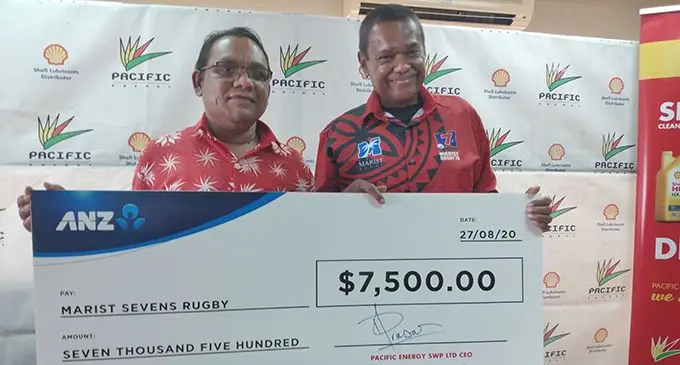 From left Pacific Energy chief marketing officer Rajnesh Prasad hands over the cheque to Marist Rugby club president Lawrence Tikaram in Suva on  August 27, 2020.   Photo: Simione Haravanua