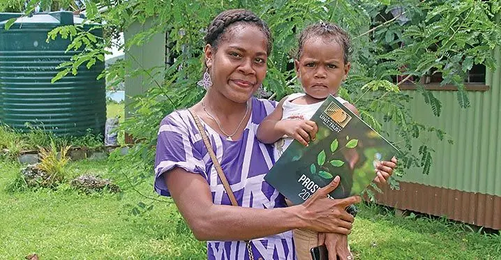 Kalesi Nasauvou and her son after opening an account with Fijian Holdings Unit Trust as an investment to her son’s future. Photo: Josefa Babitu