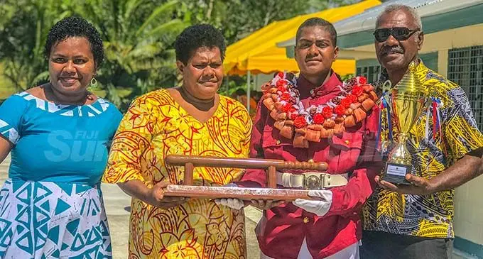 Fiji Corrections Service top female recruite Ro Litiana Donumaitoga with her parents Seruwaia Bolakauriki and Ratu Amenio Bolakauriki. Photo: Kelera Sovasiga