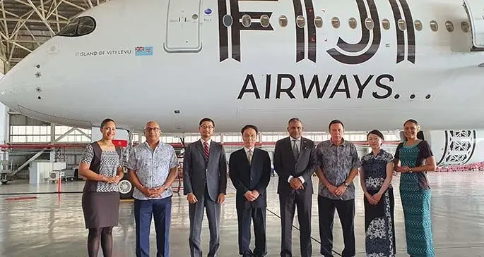 Official party outside a Fiji Airways A350 aircraft, Fiji Airways board chairman Rajesh Punja (second from left), Regional Director of ADB’s Fiji office, Masayuki Tachiiri (third from the left), Ambassador of Japan, H.E. Mr. Kawakami Fumihiro (fourth from left), Minister for Commerce, Trade, Tourism and Transport Faiyaz Koya (fourth from right), Fiji Airways managing director and chief executive officer Andre Viljoen (third from right), with Asia Development Bank officials. Photo: Fiji Airways