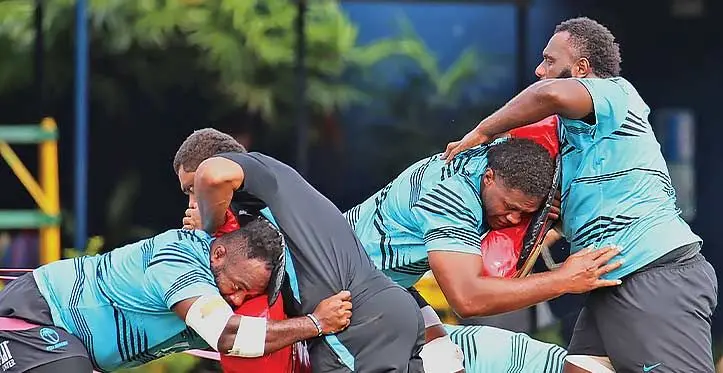 FIJI Water Flying Fijians forwards (in blue, from left) Mesake Doge, Viliame Mata and Luke Tagi go through their drill at Nadi International School ground on July 26, 2023. They flew out to Apia last night to play Manu Samoa tomorrow. Photo: Waisea Nasokia