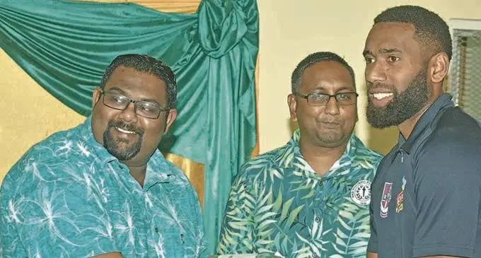 All in One Builders/Ezy Kool Nadi vice-captain Napolioni Qasevakatini receives his jersey at the Korovuto College on Saturday night. Photo: WAISEA NASOKIA